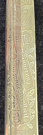 Short – Single Etch – Luftwaffe Gulls Pattern

This short variety produced by Carl Eickhorn having the 1935 – 1941 trademark has the hard to find Luftwaffe Gulls Pattern. This pattern features two Gulls flying away from the viewer within a wreath of acorns and oak leaves at the tip end, the Remembrance Motto in a ribbon centered and a closed winged National Eagle closest to the ricasso. See Pictures. 


The condition of this example is certainly NMINT or MINT as there is no wear to the blade or hilt areas. All the plating is present and no runner marks can be seen. See pictures.
As stated in The Addendum it is my opinion that this Luftwaffe Gulls pattern (among others) were being produced in advance of a newer catalog perhaps 1940. There were very few of the Luftwaffe Gulls pattern produced and perhaps only a limited quantity sold within the Carl Eickhorn Company accounting for their rarity among collectors today.
This is a beautiful etched dress bayonet with a very hard to find Luftwaffe pattern missing from most collections. 
Comes with: Black Scabbard
Certificate of Authenticity from Wayne H. Techet
Price: $2200.00 + Shipping
You’re Holding a Piece of History
#A3CEYZ